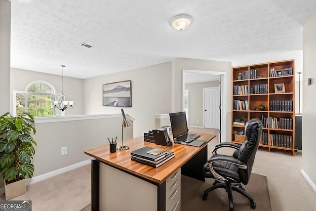 office with baseboards, a notable chandelier, light colored carpet, and visible vents