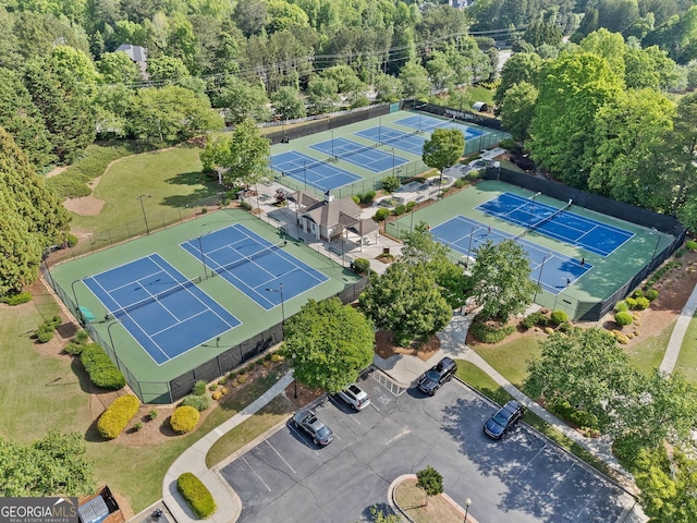 birds eye view of property with a wooded view