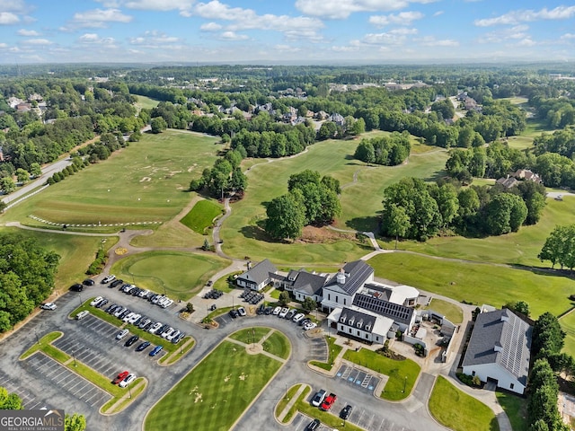 birds eye view of property with view of golf course