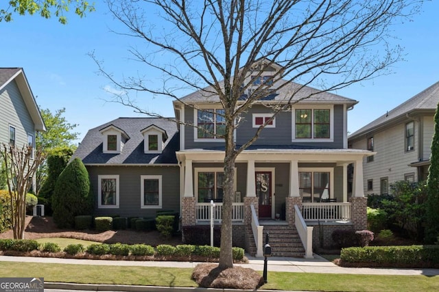 9988 Devonshire St, Douglasville, GA 30135 - view of front of property featuring brick siding, a front lawn, and covered porch