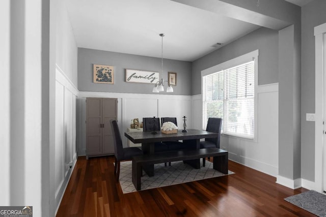 9988 Devonshire St, Douglasville, GA 30135 - dining room featuring wood finished floors, a decorative wall, and a wainscoted wall