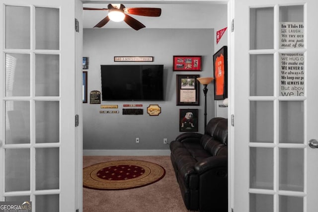 9988 Devonshire St, Douglasville, GA 30135 - carpeted living area featuring ceiling fan and baseboards