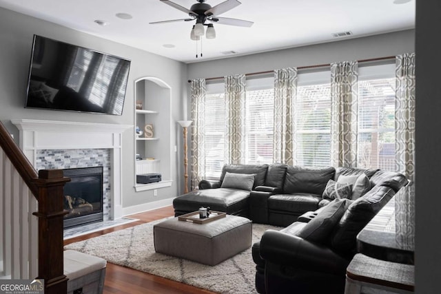 9988 Devonshire St, Douglasville, GA 30135 - living room with visible vents, plenty of natural light, ceiling fan, and a tile fireplace