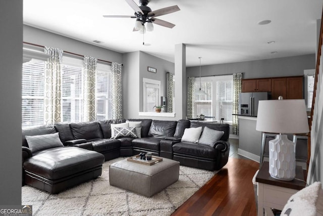 9988 Devonshire St, Douglasville, GA 30135 - living room featuring baseboards, a ceiling fan, wood finished floors, and visible vents