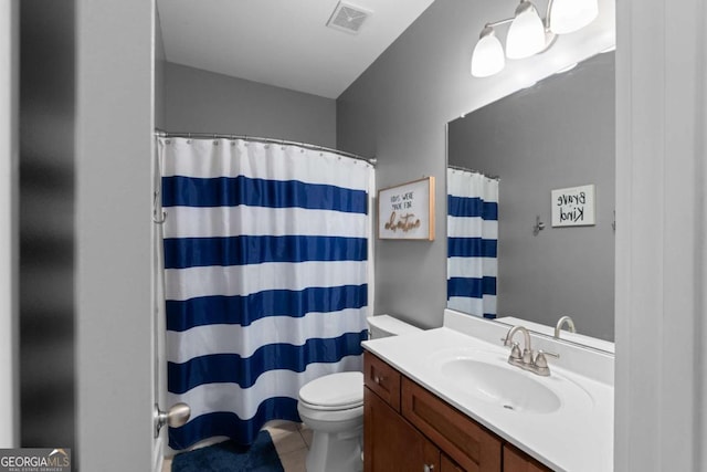 9988 Devonshire St, Douglasville, GA 30135 - full bath featuring a shower with curtain, visible vents, vanity, tile patterned floors, and toilet