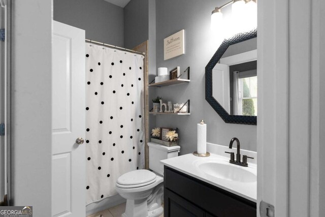 9988 Devonshire St, Douglasville, GA 30135 - bathroom with vanity, tile patterned floors, toilet, and a shower with curtain