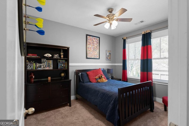 9988 Devonshire St, Douglasville, GA 30135 - bedroom featuring baseboards, a ceiling fan, carpet flooring, and visible vents