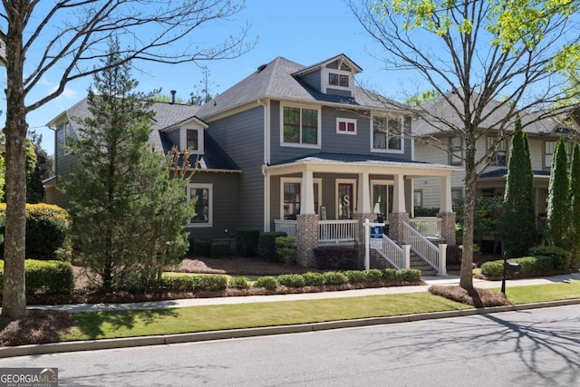 9988 Devonshire St, Douglasville, GA 30135 - american foursquare style home with a shingled roof and covered porch