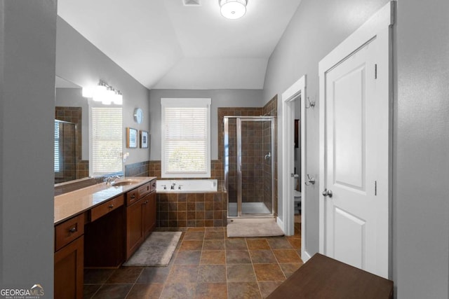 9988 Devonshire St, Douglasville, GA 30135 - bathroom featuring vanity, toilet, lofted ceiling, a bath, and a stall shower