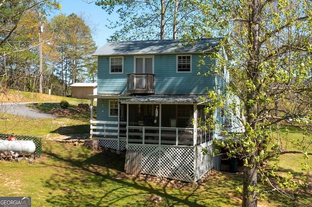 329 Ed King Rd, Blairsville, GA 30512 - rear view of property featuring a yard, a balcony, and metal roof
