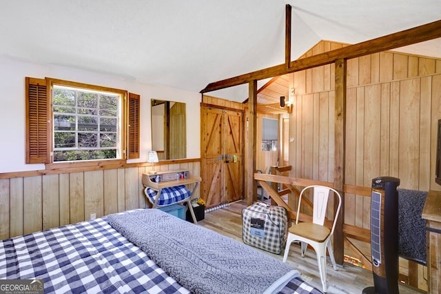 329 Ed King Rd, Blairsville, GA 30512 - bedroom featuring vaulted ceiling, wood walls, wood finished floors, and wainscoting