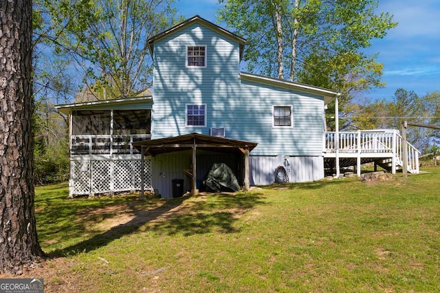 329 Ed King Rd, Blairsville, GA 30512 - back of property with a lawn, a sunroom, and a deck