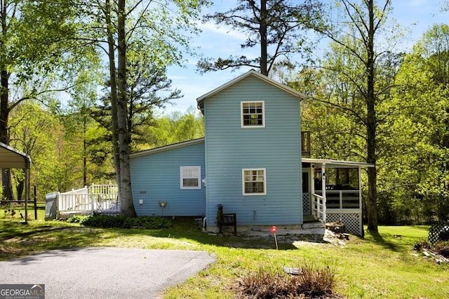 329 Ed King Rd, Blairsville, GA 30512 - rear view of property featuring a sunroom, a yard, and a deck