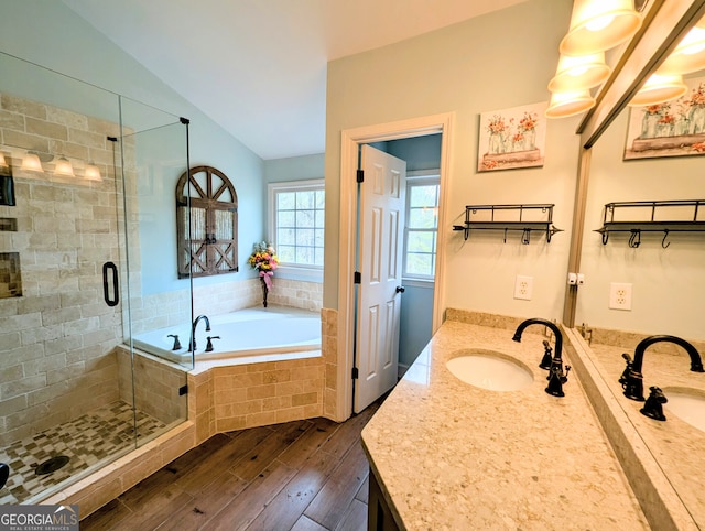 1581 Shetland Pony Ct NW, Suwanee, GA 30024 - full bathroom with vaulted ceiling, wood finished floors, a stall shower, a garden tub, and vanity