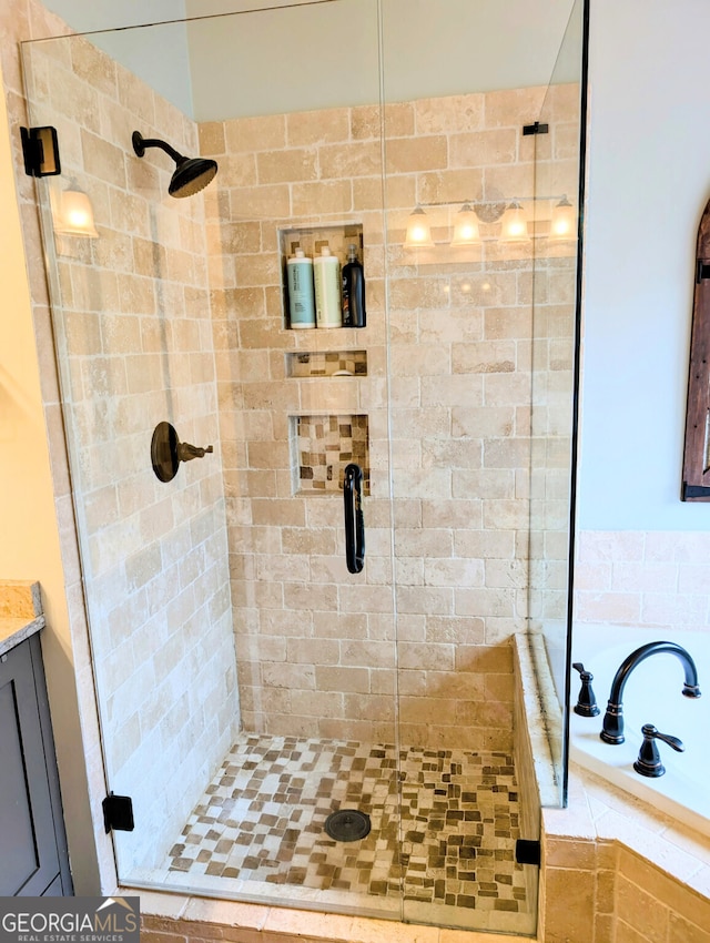 1581 Shetland Pony Ct NW, Suwanee, GA 30024 - bathroom with a stall shower and a relaxing tiled tub