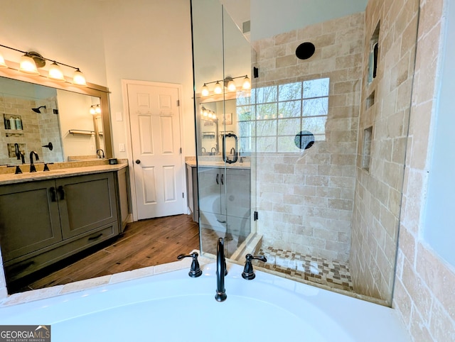 1581 Shetland Pony Ct NW, Suwanee, GA 30024 - bathroom featuring a shower stall, wood finished floors, vanity, and a bath