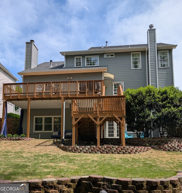 1581 Shetland Pony Ct NW, Suwanee, GA 30024 - back of property featuring a chimney, a wooden deck, and a lawn