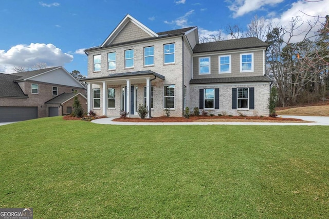 view of front of property featuring brick siding and a front yard