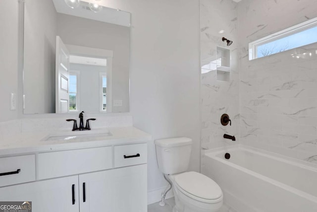 bathroom featuring baseboards, toilet, vanity, and shower / bathing tub combination