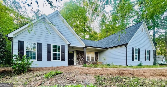 7675 Lanier View Rdg, Cumming, GA 30041 - ranch-style house featuring stone siding and roof with shingles