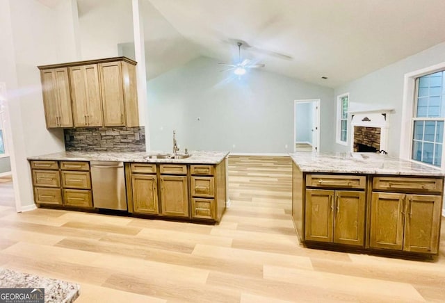 7675 Lanier View Rdg, Cumming, GA 30041 - kitchen featuring stainless steel dishwasher, ceiling fan, light wood finished floors, open floor plan, and lofted ceiling