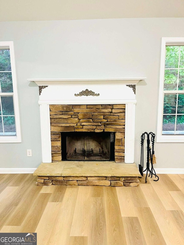 7675 Lanier View Rdg, Cumming, GA 30041 - detailed view of a stone fireplace and wood finished floors