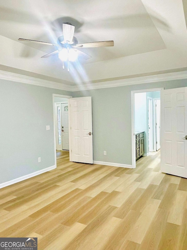 7675 Lanier View Rdg, Cumming, GA 30041 - empty room featuring light wood finished floors, a ceiling fan, and ornamental molding