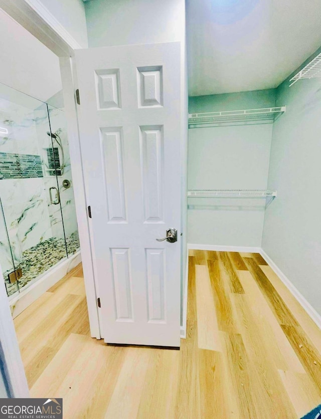 7675 Lanier View Rdg, Cumming, GA 30041 - spacious closet with wood finished floors