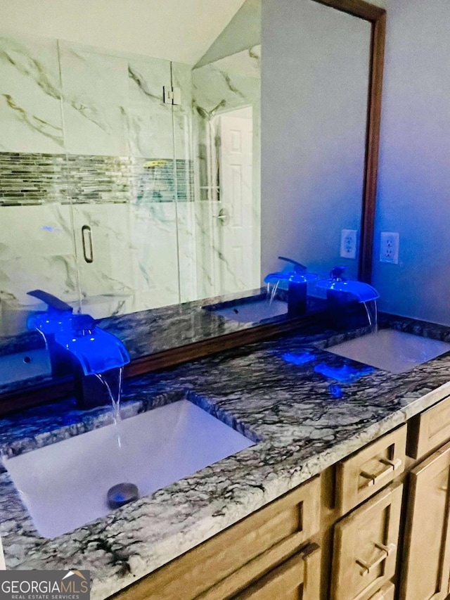 7675 Lanier View Rdg, Cumming, GA 30041 - bathroom with vanity, a shower stall, and vaulted ceiling