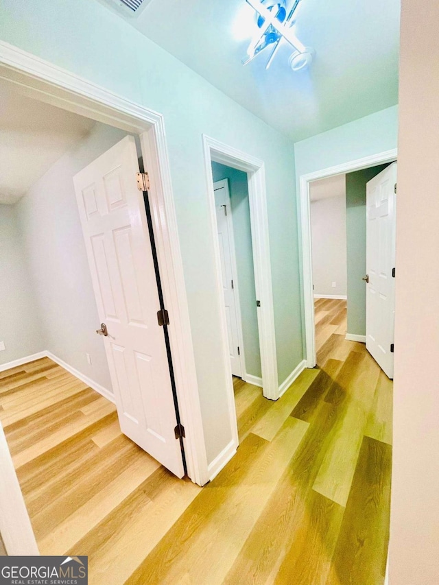 7675 Lanier View Rdg, Cumming, GA 30041 - corridor featuring wood finished floors