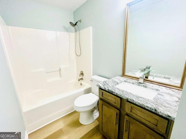 7675 Lanier View Rdg, Cumming, GA 30041 - bathroom with toilet, vanity, shower / bath combination, and wood finished floors