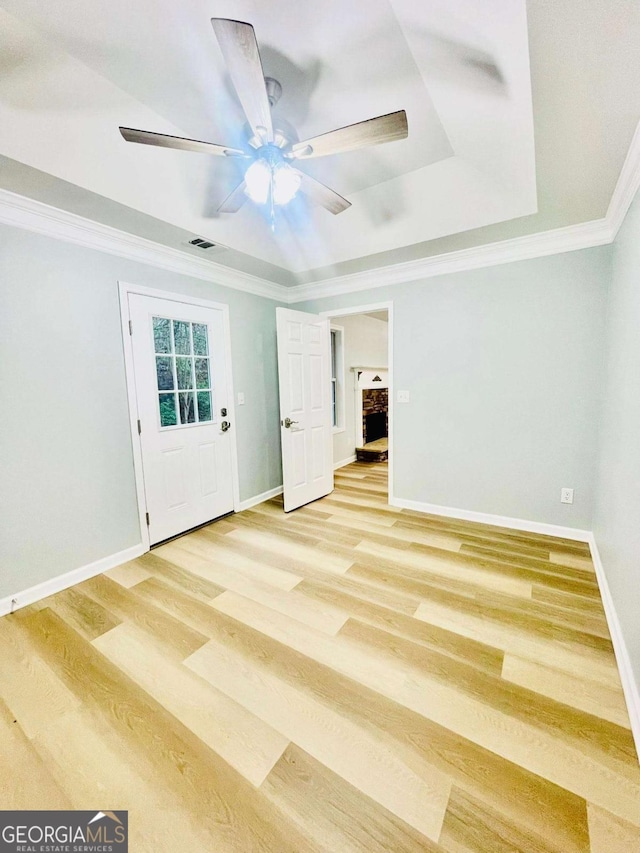 7675 Lanier View Rdg, Cumming, GA 30041 - unfurnished room featuring crown molding, light wood-type flooring, a ceiling fan, and a raised ceiling