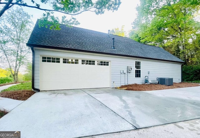 7675 Lanier View Rdg, Cumming, GA 30041 - view of side of home with driveway and a shingled roof