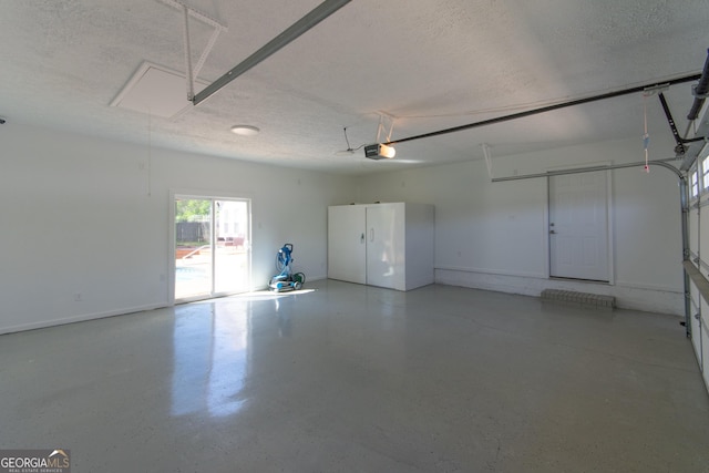 5 Gibson Rd, Newnan, GA 30263 - garage with a garage door opener and baseboards