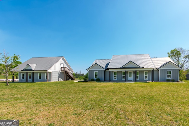 5 Gibson Rd, Newnan, GA 30263 - view of front of home with stairs, metal roof, and a front yard
