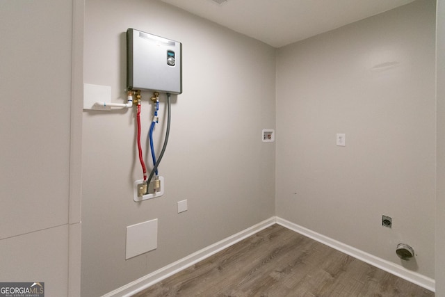 5 Gibson Rd, Newnan, GA 30263 - washroom featuring wood finished floors, electric dryer hookup, baseboards, and hookup for a washing machine