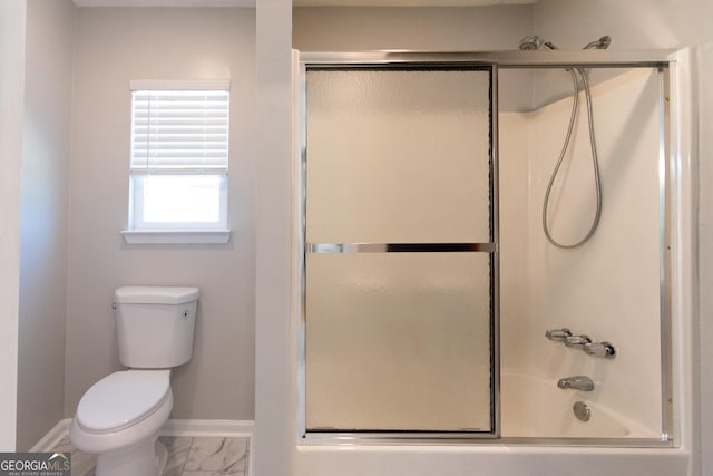 5 Gibson Rd, Newnan, GA 30263 - bathroom featuring baseboards, toilet, marble finish floors, and combined bath / shower with glass door