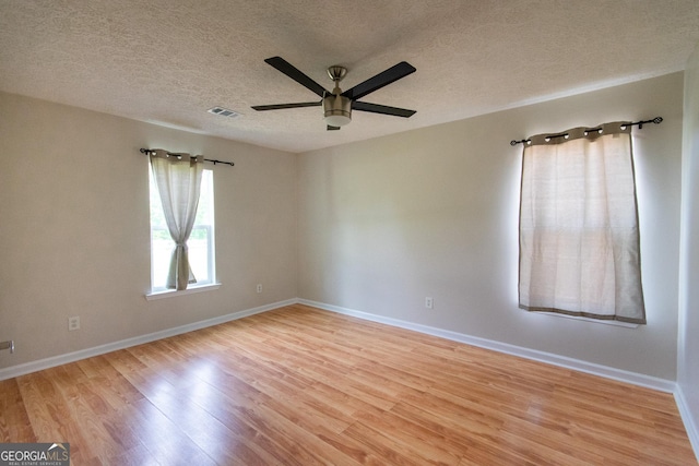 5 Gibson Rd, Newnan, GA 30263 - empty room with ceiling fan, light wood finished floors, a textured ceiling, and baseboards