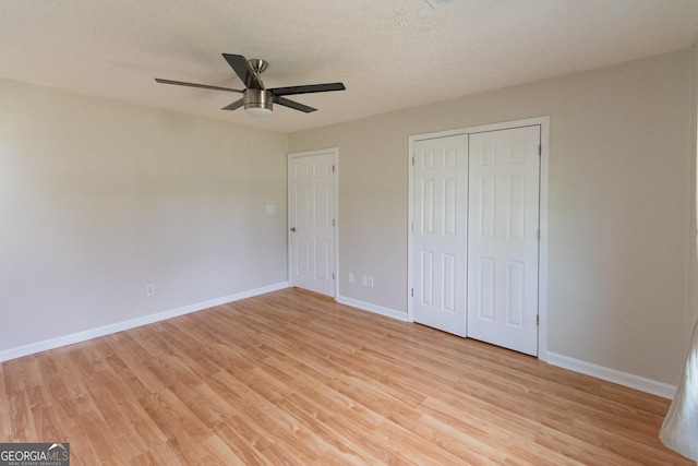 5 Gibson Rd, Newnan, GA 30263 - unfurnished bedroom featuring light wood finished floors, baseboards, a closet, and ceiling fan