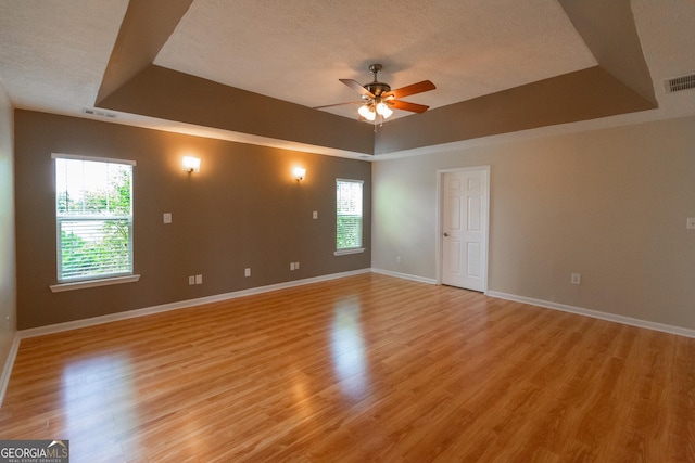 5 Gibson Rd, Newnan, GA 30263 - unfurnished room with a raised ceiling, ceiling fan, plenty of natural light, and a textured ceiling