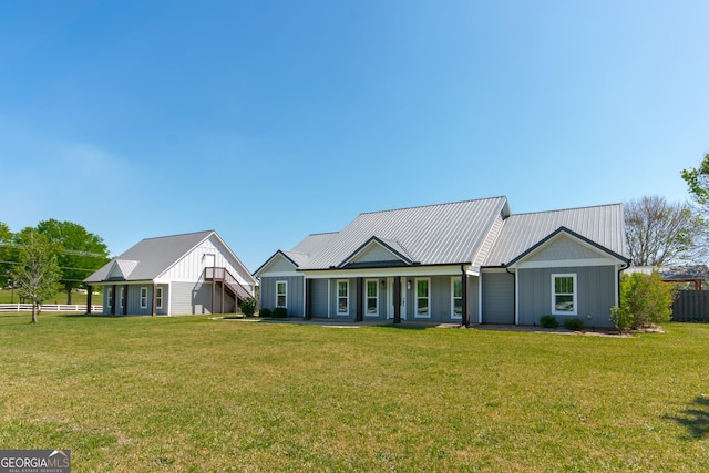 5 Gibson Rd, Newnan, GA 30263 - modern inspired farmhouse featuring board and batten siding, a front lawn, and metal roof