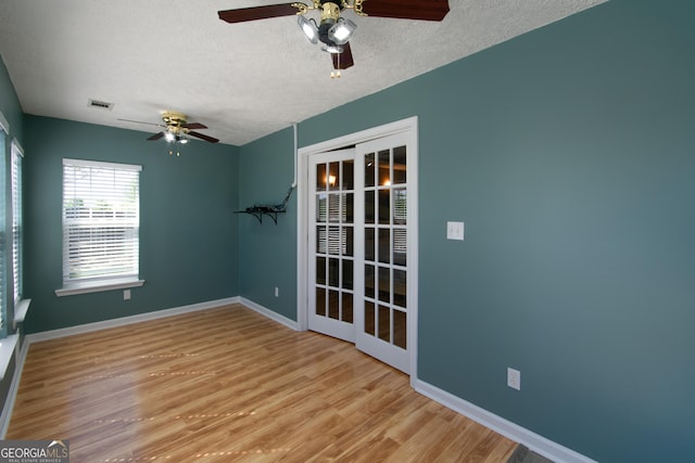 5 Gibson Rd, Newnan, GA 30263 - empty room featuring a ceiling fan, a textured ceiling, wood finished floors, and baseboards