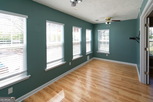 5 Gibson Rd, Newnan, GA 30263 - spare room featuring ceiling fan, plenty of natural light, a textured ceiling, and light wood-style flooring