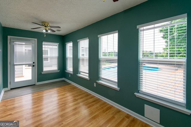5 Gibson Rd, Newnan, GA 30263 - spare room featuring ceiling fan, a textured ceiling, wood finished floors, and baseboards