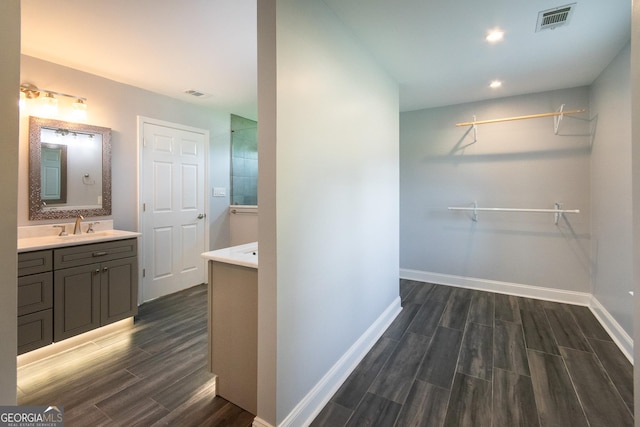 5 Gibson Rd, Newnan, GA 30263 - bathroom featuring wood finished floors, vanity, baseboards, and recessed lighting