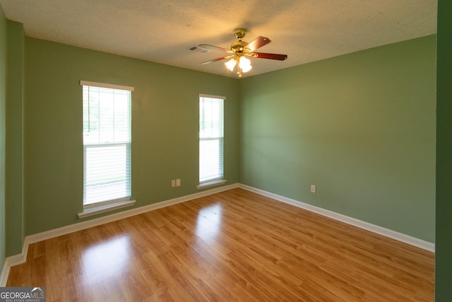 5 Gibson Rd, Newnan, GA 30263 - empty room with light wood-type flooring, a textured ceiling, baseboards, and ceiling fan
