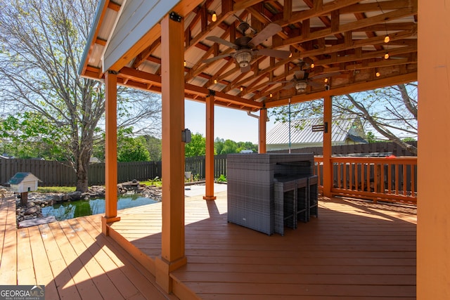 5 Gibson Rd, Newnan, GA 30263 - wooden terrace with ceiling fan and a fenced backyard