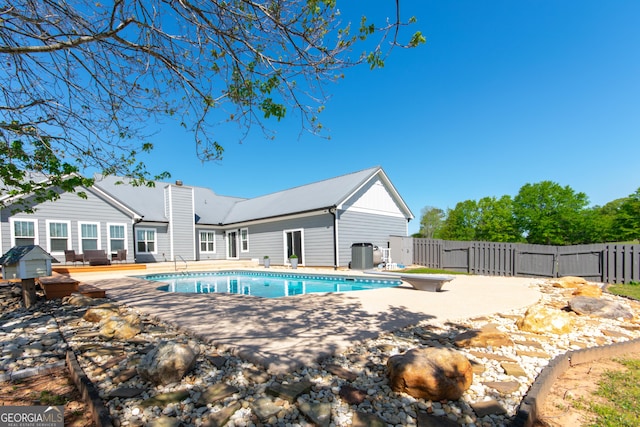 5 Gibson Rd, Newnan, GA 30263 - view of swimming pool with fence, a gate, a diving board, and cooling unit