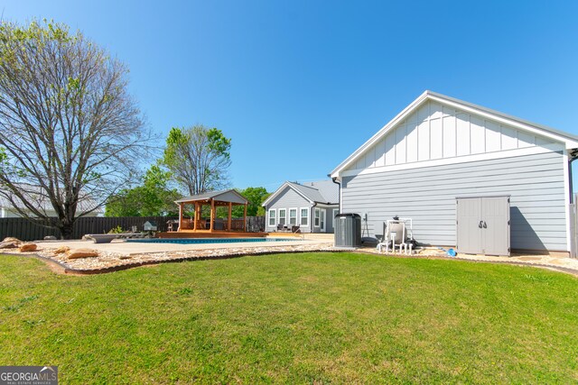 5 Gibson Rd, Newnan, GA 30263 - rear view of house with a gazebo, central AC, and board and batten siding