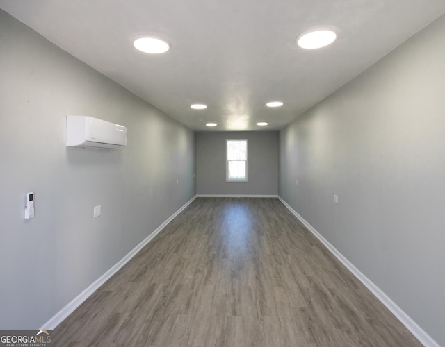 5 Gibson Rd, Newnan, GA 30263 - spare room with wood finished floors, baseboards, and a wall unit AC